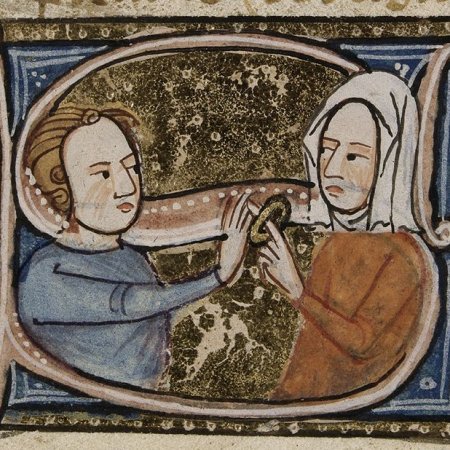 Medieval man places ring on bride