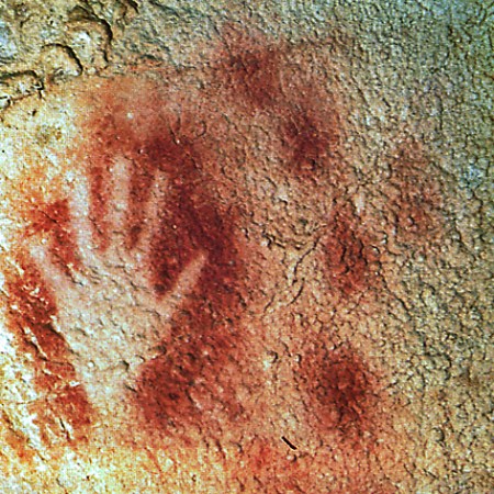 Stencil of hand on cave wall