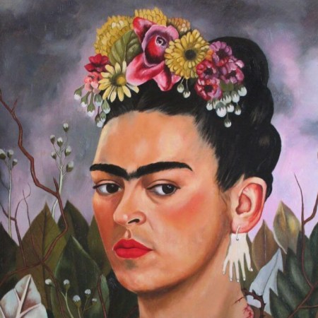 Woman with unibrow, flowers in hair, and a necklace of thorns