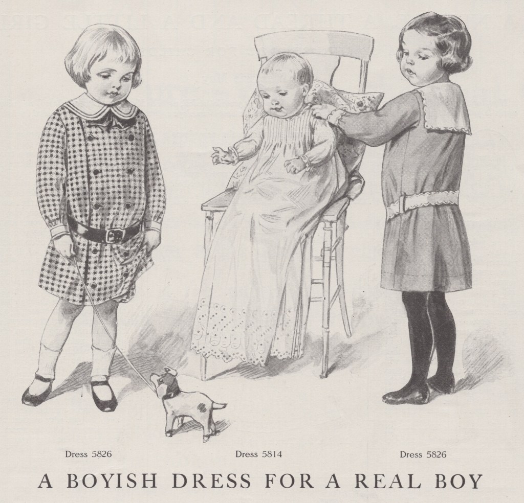 Three children in dresses with caption "A Boyish Dress for a Real Boy"