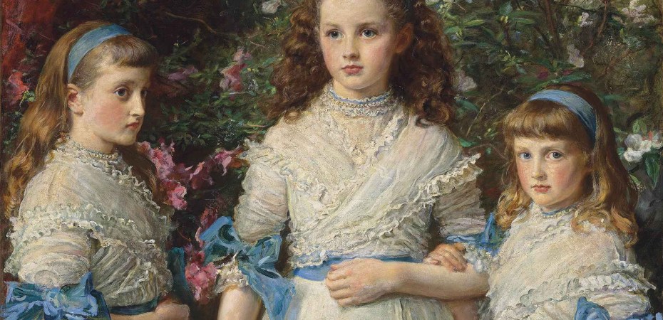 Three girls in white dresses with blue sashes