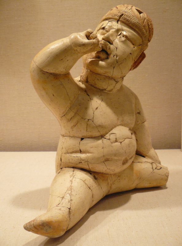 Ceramic baby with hand in mouth