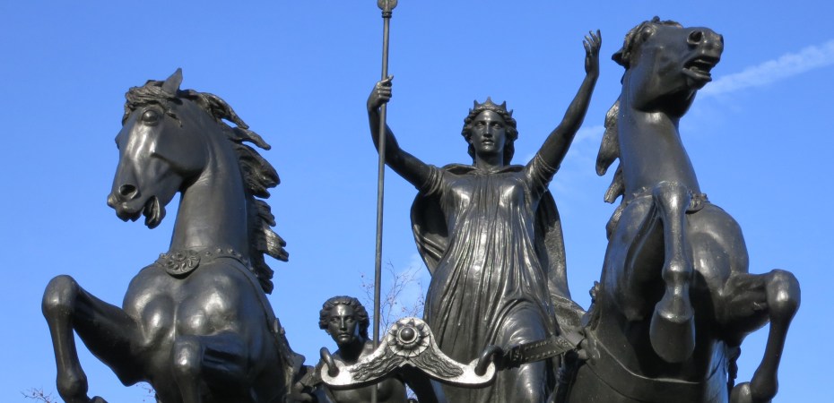 bronze statue of woman on horse drawn war chariot